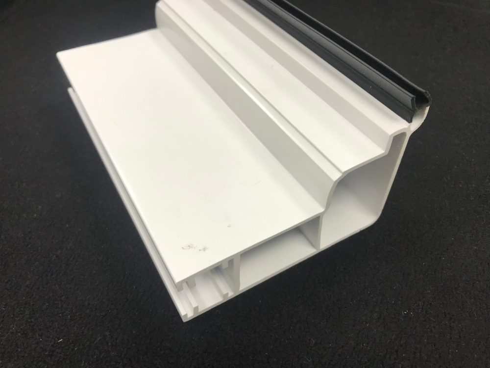 White rigid plastic window section profile